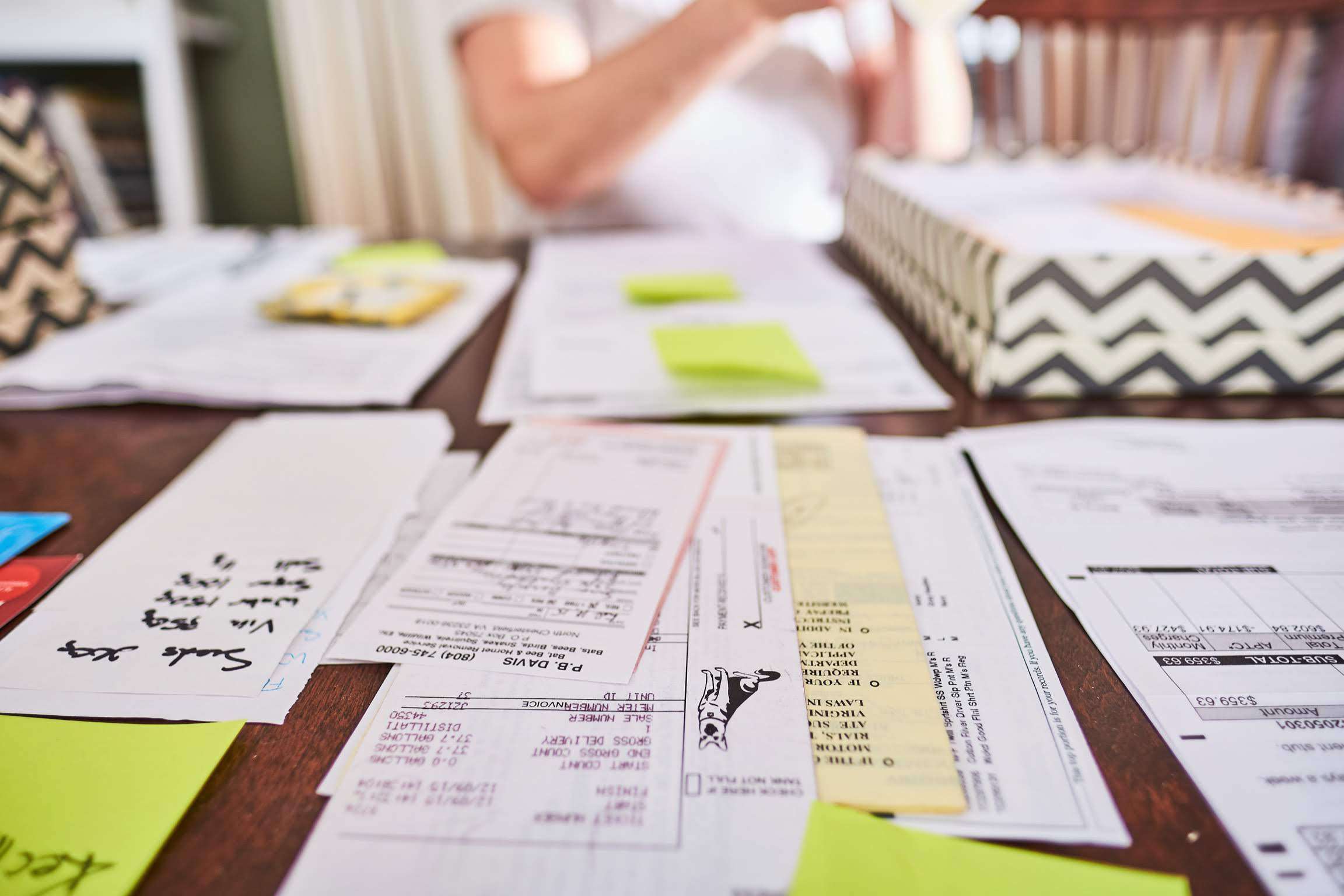 Sorted piles of paper on table